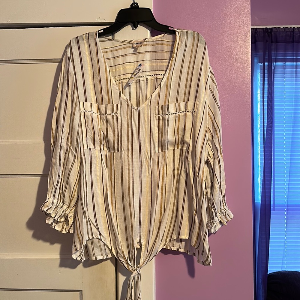 Cream. Brown and gold shirt